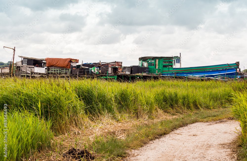 Skipool Creek, Thornton Cleveleys, Lancashire, UK. August 11th 2015. Old wooden boats at low tide at Skipool Creek, Lancashire, uk. Skipool Creek, Thornton Cleveleys, Lancashire, UK. August 11th 2015. Old wooden boats at low tide at Skipool Creek, Lancashire, uk.