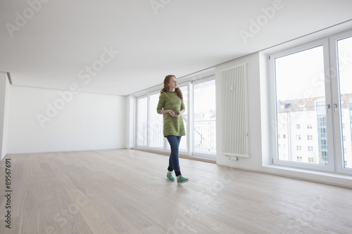 Young house-hunting woman viewing modern flat