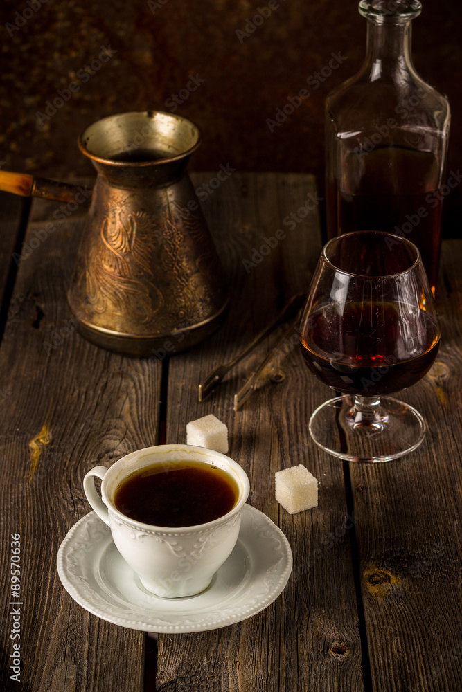 Coffee and cognac on wooden table. Coffee and cognac on wooden table.