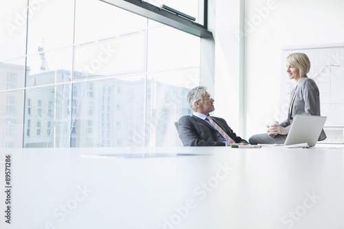 Businessman and businesswoman meeting informally photo