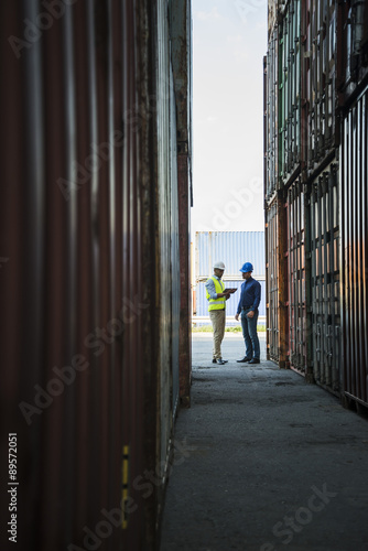 Wallpaper Mural Two men with safety helmets talking at container port Torontodigital.ca