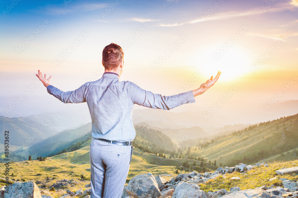 businessman at the top of the mountain sitting and thinking businessman at the top of the mountain sitting and thinking