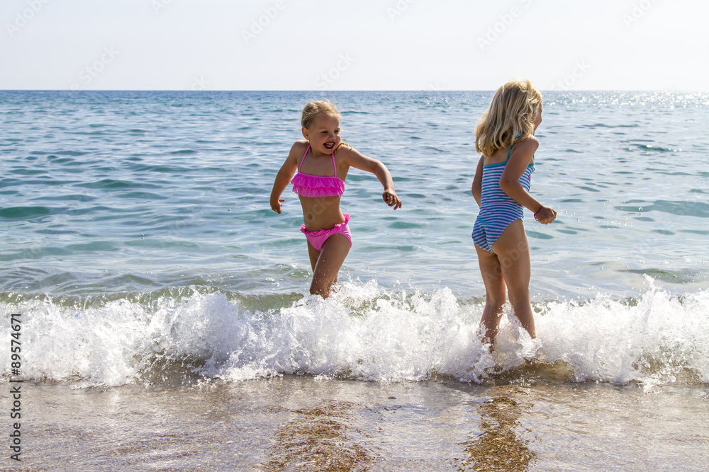 Greece, Corfu, Agios Georgios, two little girls bathing Greece, Corfu, Agios Georgios, two little girls bathing