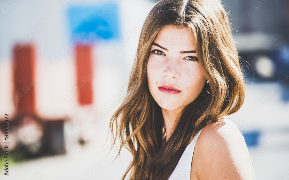 Portrait of a serious brunette young woman outdoors Portrait of a serious brunette young woman outdoors