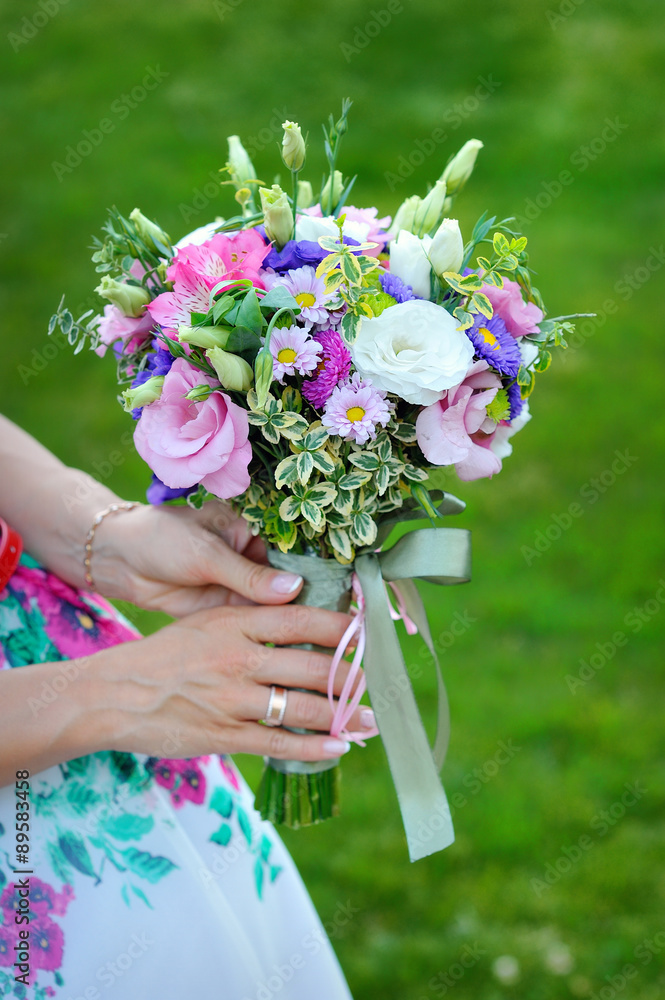Fototapeta premium Bride holding beautiful wedding bouquet