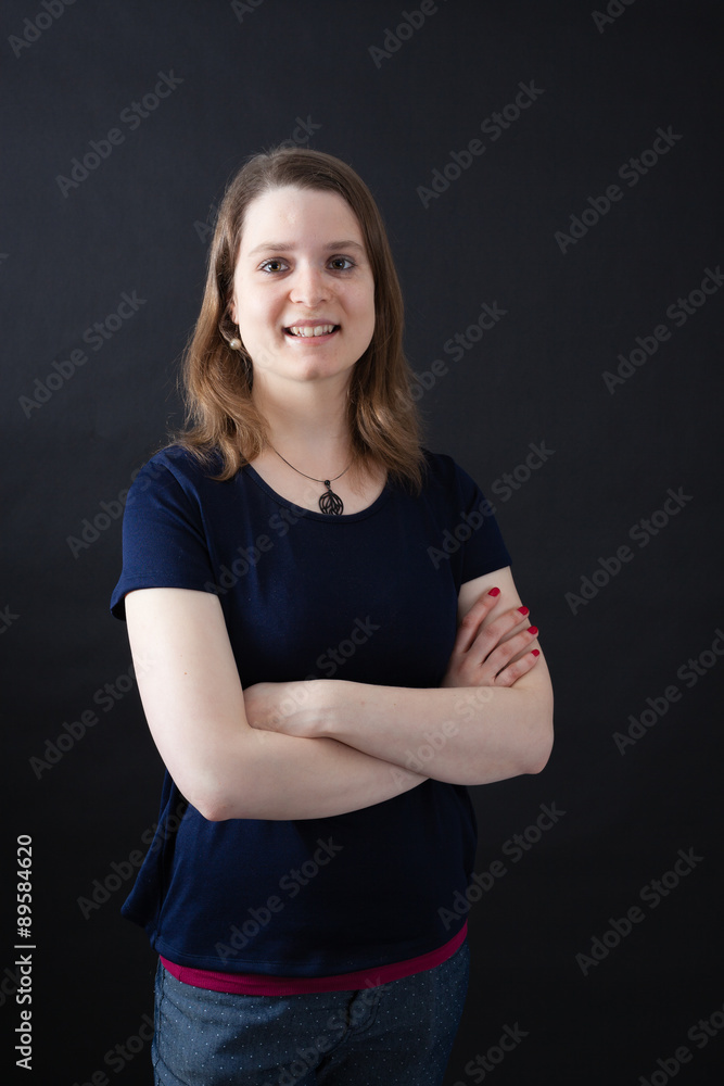Beautiful woman doing different expressions in different sets of clothes: arms crossed Beautiful woman doing different expressions in different sets of clothes: arms crossed