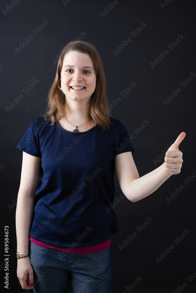 Beautiful woman doing different expressions in different sets of clothes: thumbs up Beautiful woman doing different expressions in different sets of clothes: thumbs up