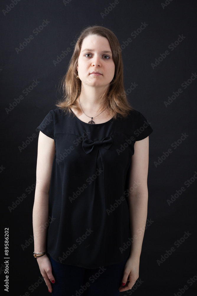 Beautiful woman doing different expressions in different sets of clothes: at attention Beautiful woman doing different expressions in different sets of clothes: at attention