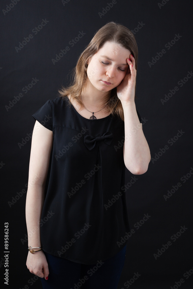 Beautiful woman doing different expressions in different sets of clothes: headache Beautiful woman doing different expressions in different sets of clothes: headache