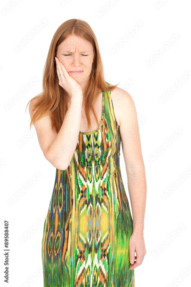 Beautiful woman doing different expressions in different sets of clothes: toothache Beautiful woman doing different expressions in different sets of clothes: toothache