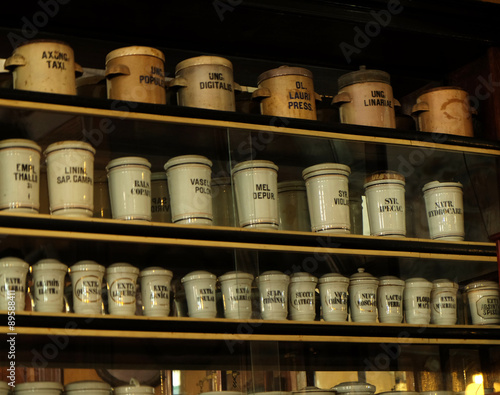 Jars on wooden shelves in shop