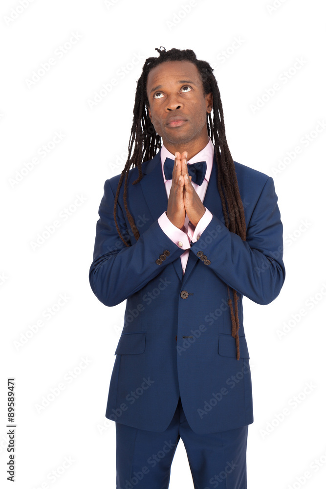 Handsome man with dreadlocks doing different expressions in different sets of clothes: praying Handsome man with dreadlocks doing different expressions in different sets of clothes: praying