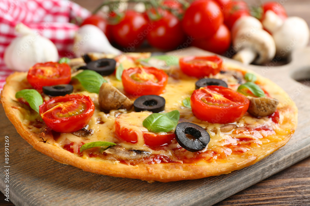 Tasty pizza with vegetables and basil on table close up Tasty pizza with vegetables and basil on table close up