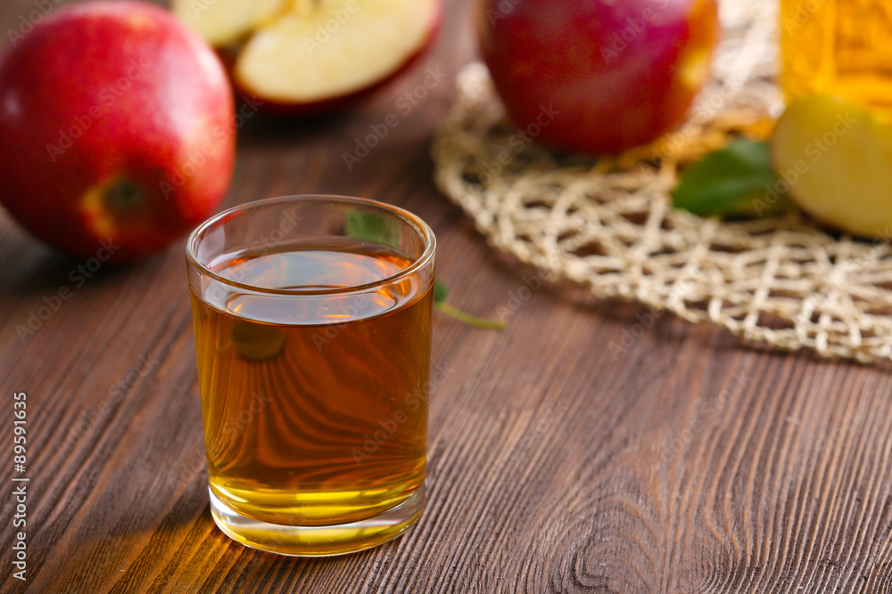Glass of apple juice and fruits on table close up Glass of apple juice and fruits on table close up