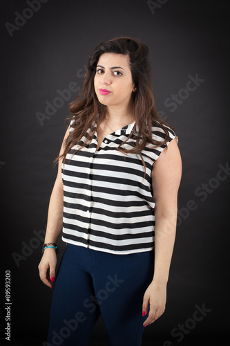 Beautiful woman doing different expressions in different sets of clothes: posing