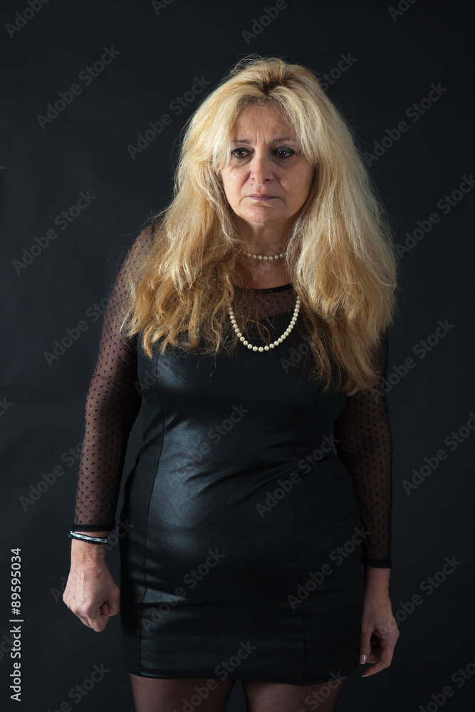 Fototapeta premium Beautiful woman man doing different expressions in different sets of clothes: sad