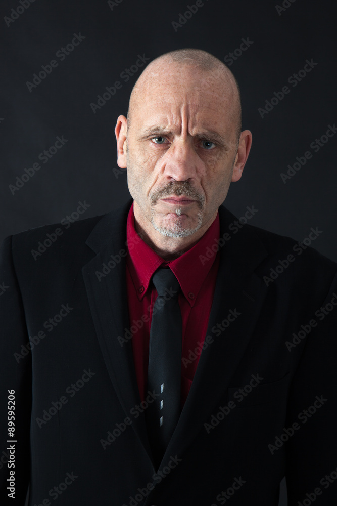 Handsome man doing different expressions in different sets of clothes: angry Handsome man doing different expressions in different sets of clothes: angry