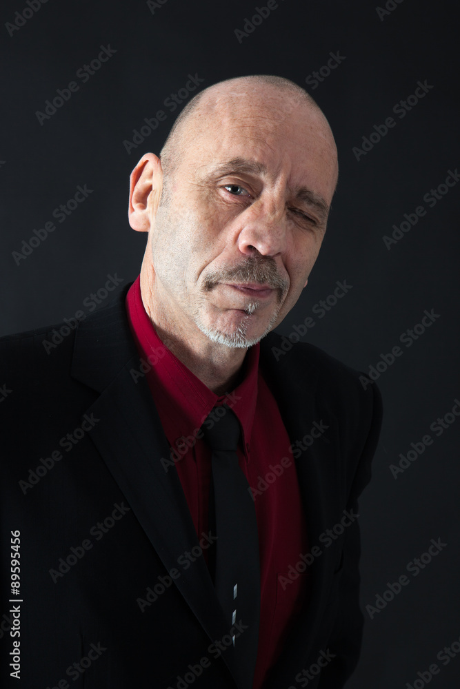 Handsome man doing different expressions in different sets of clothes: blinking Handsome man doing different expressions in different sets of clothes: blinking