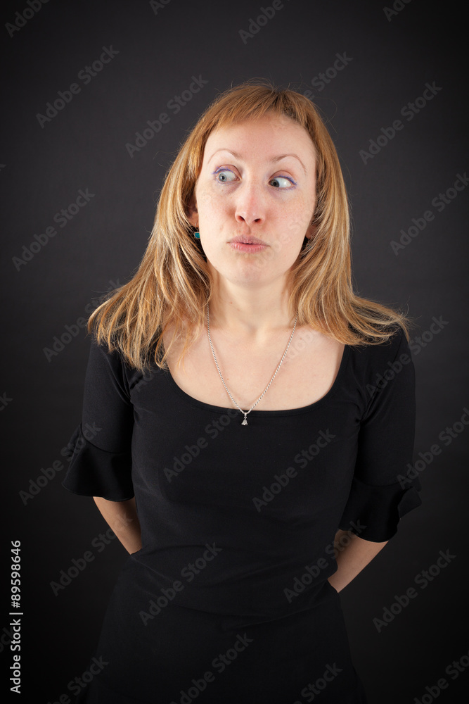 Fototapeta premium beautiful woman doing different expressions in different sets of clothes: worried