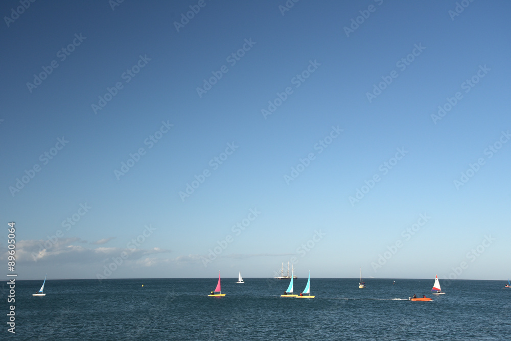 Yachts at sea off  Swanage beach in Dorset