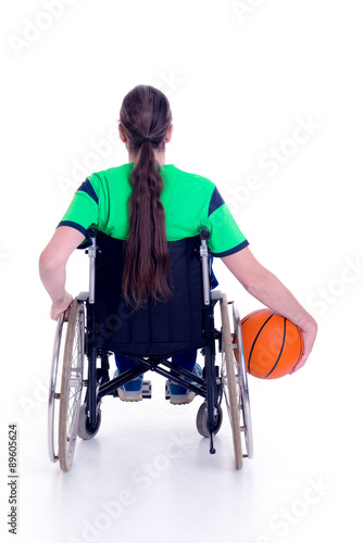 disabled man in a wheelchair is doing sport with ball