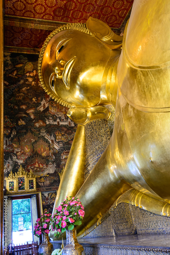 Giant Buddha inside Wat Pho Temple, Bangkok in Thailand.