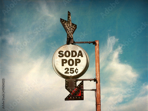 aged and worn vintage photo of retro soda pop sign