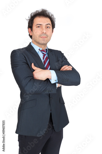 Handsome arabic man doing different expressions in different sets of clothes: arms crossed