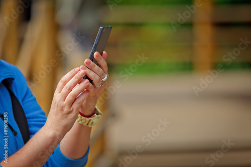 Female hand takes pictures with mobile smart phone