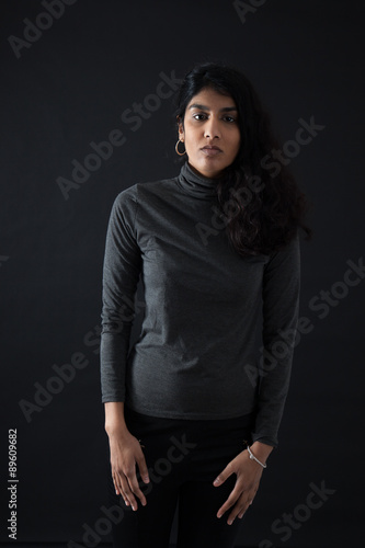 Beautiful woman doing different expressions in different sets of clothes: thinking