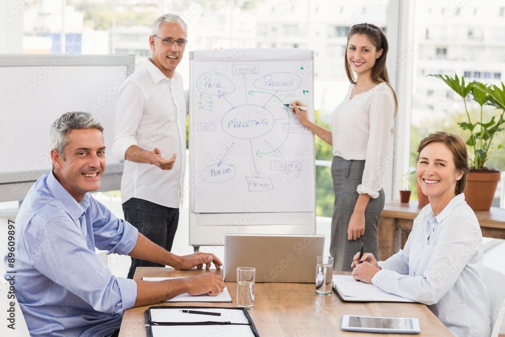 Fototapeta premium Smiling business people having a meeting