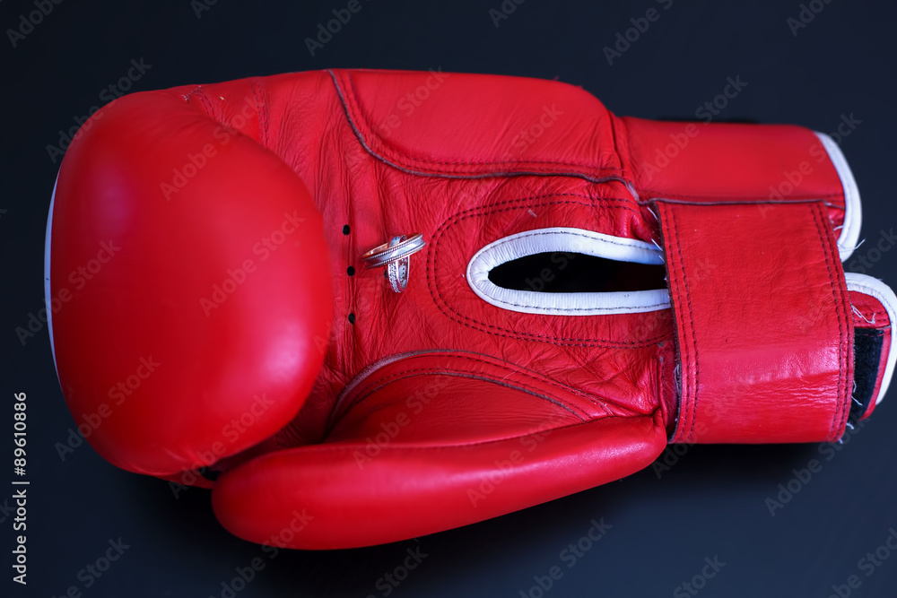 Gold Wedding Rings on Red Boxing Glove. Sport and Family