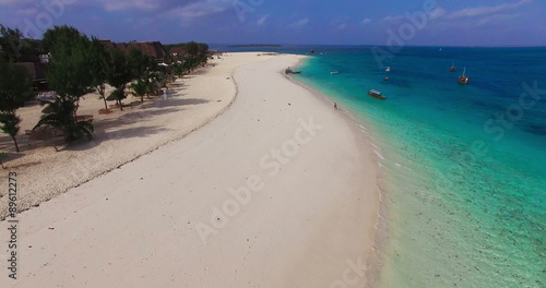 Aerial view Flying camera over Sea Beach. Africa. Tanzania. Zanzibar. Travel tourism adventure in wild nature camera bird eye view.