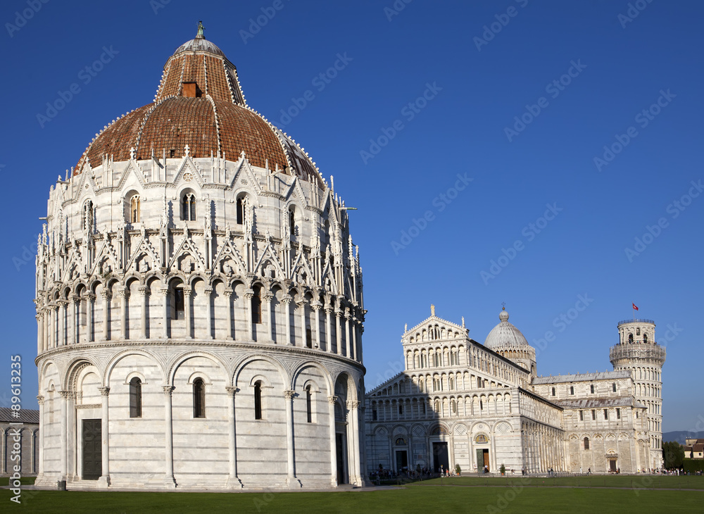 The Baptistry and the Leaning Tower in Cathedral Square in Pisa, Italy..