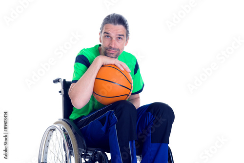 disabled man in a wheelchair is doing sport with ball