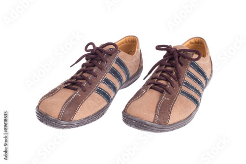 Man's leather brown shoes isolated on white background