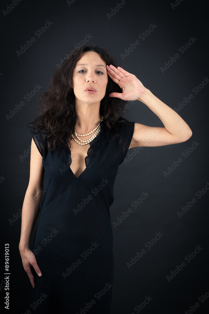 Beautiful woman doing different expressions in different sets of clothes: at attention Beautiful woman doing different expressions in different sets of clothes: at attention