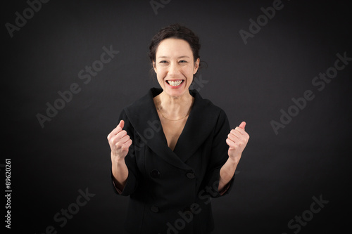 beautiful woman doing different expressions in different sets of clothes: arms raised