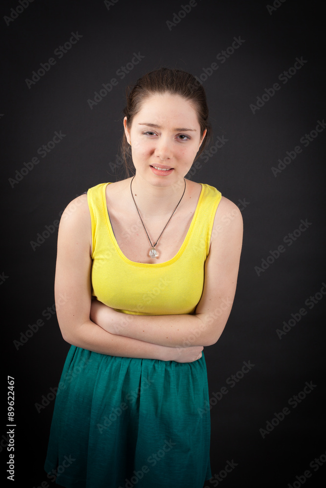 beautiful woman doing different expressions in different sets of clothes: stomachache beautiful woman doing different expressions in different sets of clothes: stomachache