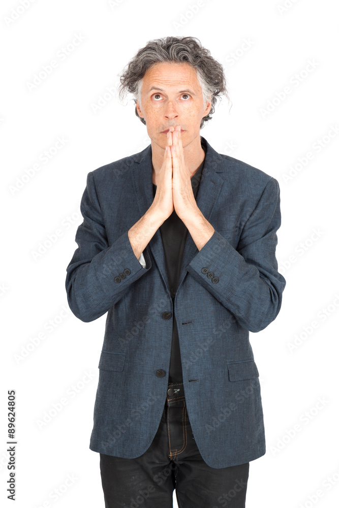 Handsome man doing different expressions in different sets of clothes: praying Handsome man doing different expressions in different sets of clothes: praying