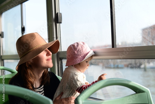 Mom and daughter having a tour through Venice in vaporetto