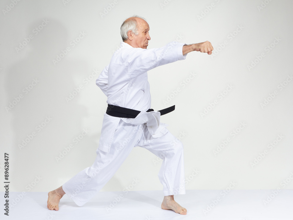 Man in karategi is beating kick gyaku-tsuki Man in karategi is beating kick gyaku-tsuki
