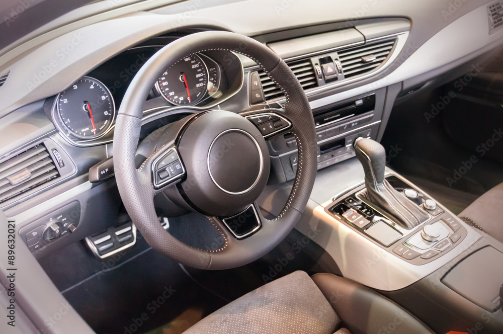 Obraz premium Black luxury car Interior - steering wheel, shift lever and dash