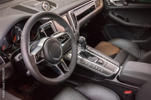 Black luxury car Interior - steering wheel, shift lever and dash © vchalup
