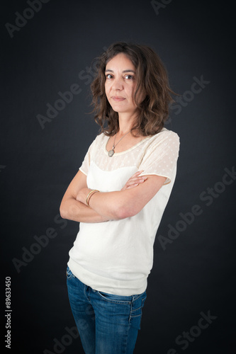 Beautiful woman doing different expressions in different sets of clothes: arms crossed