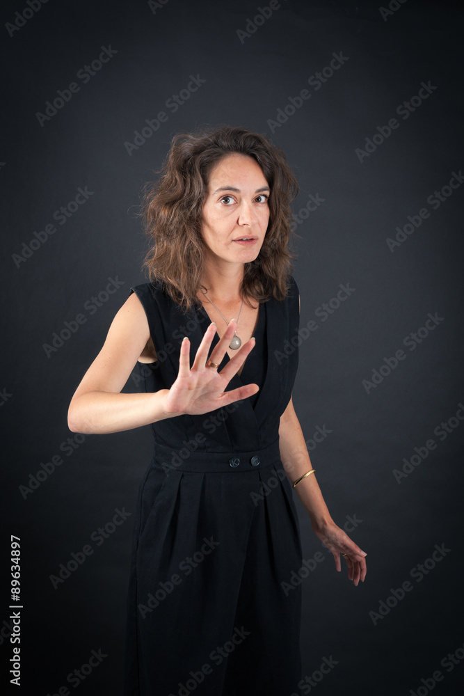 Beautiful woman doing different expressions in different sets of clothes: stop sign Beautiful woman doing different expressions in different sets of clothes: stop sign