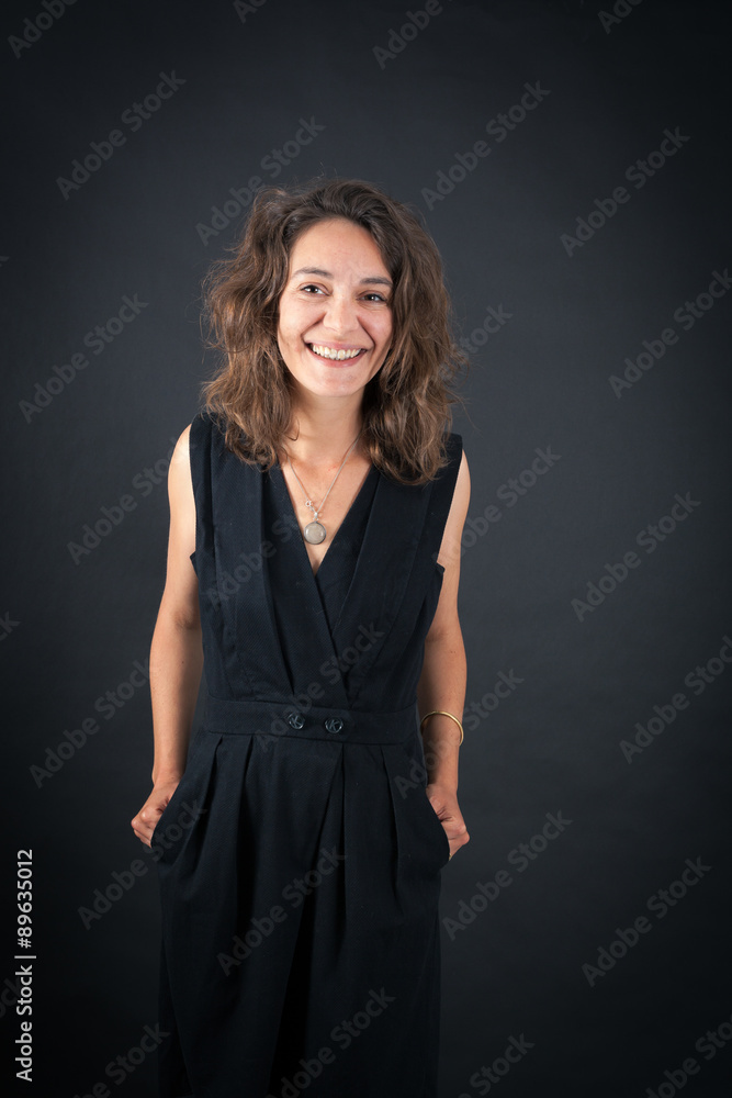 Beautiful woman doing different expressions in different sets of clothes: smile Beautiful woman doing different expressions in different sets of clothes: smile