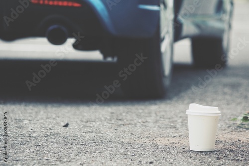 Coffee paper cup with car on the road