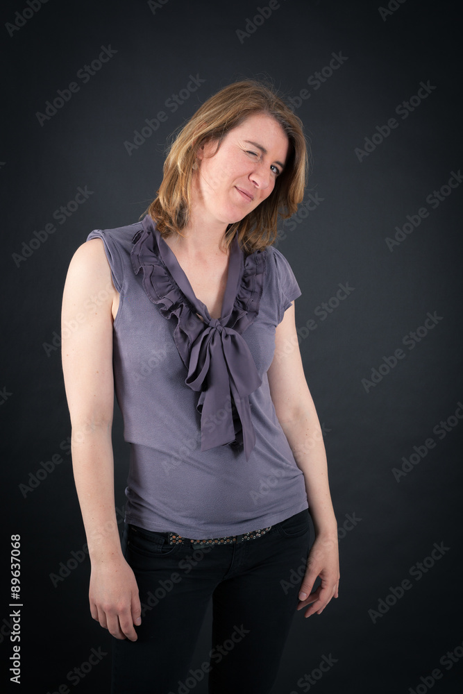 Beautiful woman doing different expressions in different sets of clothes: blinking Beautiful woman doing different expressions in different sets of clothes: blinking
