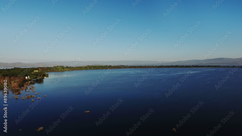Aerial view flying over river. Kenya. Africa. Travel tourism adventure from bird eye view. Aerial view flying over river. Kenya. Africa. Travel tourism adventure from bird eye view.